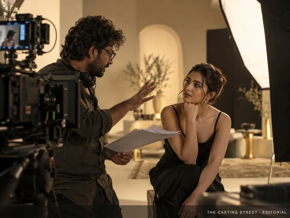 Illustrative filmmaker and performer collaborating on a studio shoot